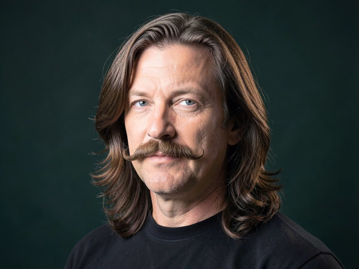 Man with a long hair with handlebar mustache