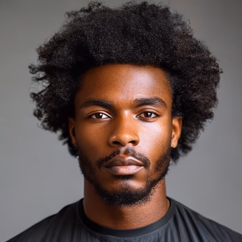 Afro Drop Fade hairstyle for men 2026 — Afro variation, best for Clean silhouette from every angle, modern barbering by Master Stylist Jessica Hamilton
