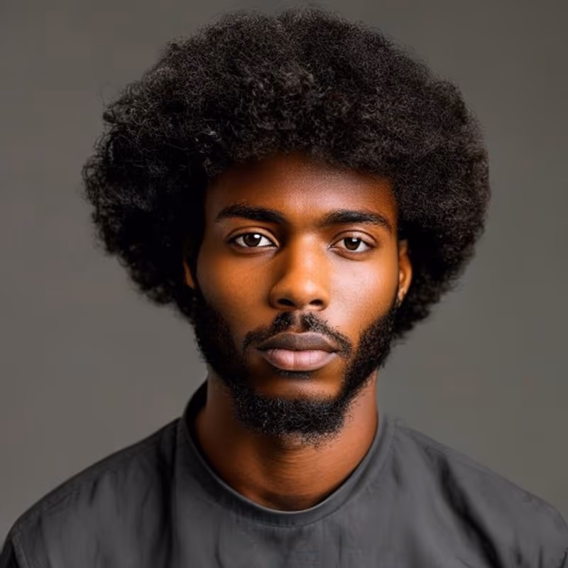 Classic Afro hairstyle for men 2026 — Afro variation, best for Natural coily hair (4A–4C), modern barbering by Master Stylist Jessica Hamilton