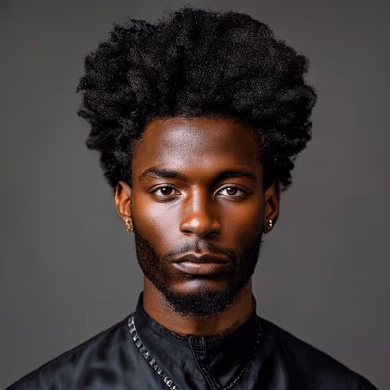Frohawk hairstyle for men 2026 — Afro variation, best for Bold, edgy statement looks, modern barbering by Master Stylist Jessica Hamilton
