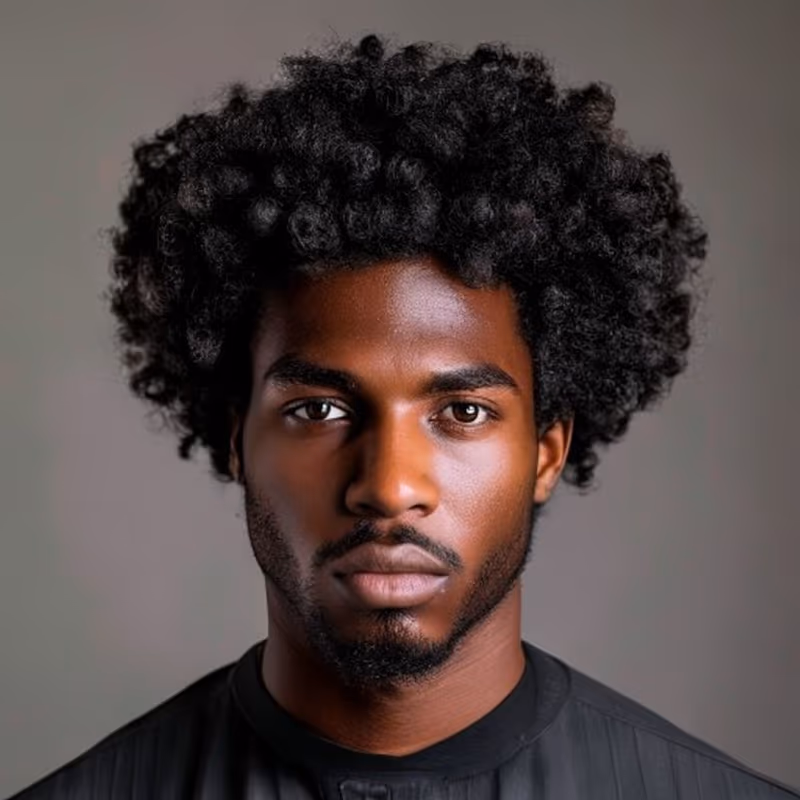 Sponge Curl Afro hairstyle for men 2026 — Afro variation, best for Defined-curl natural texture, modern barbering by Master Stylist Jessica Hamilton