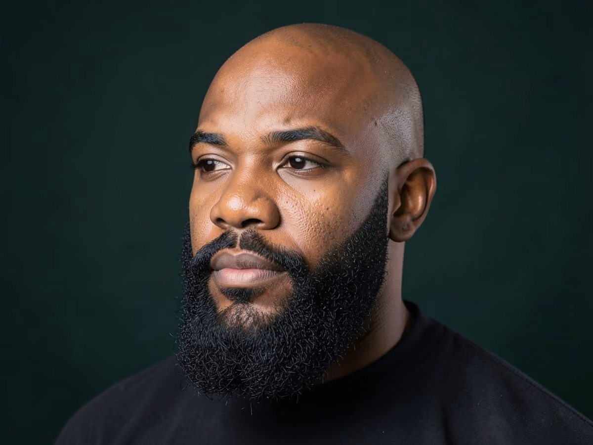 Man with a bald with full beard haircut