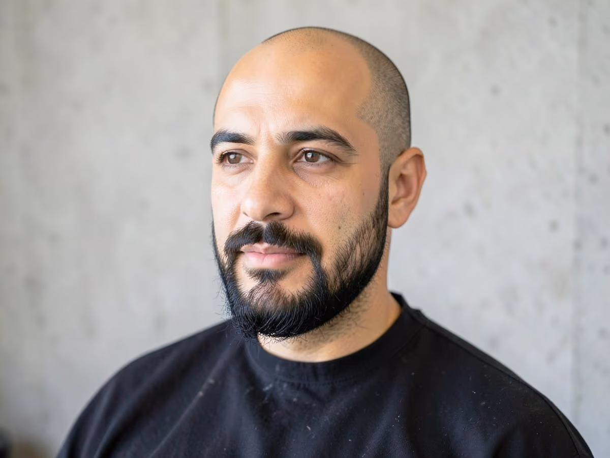 Man with a bald with goatee haircut