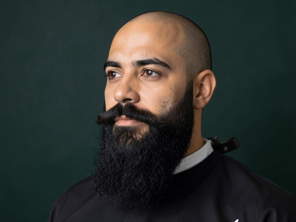 Man with a bald with long beard haircut