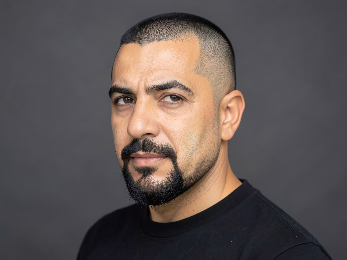 Man with a baseball fade with goatee