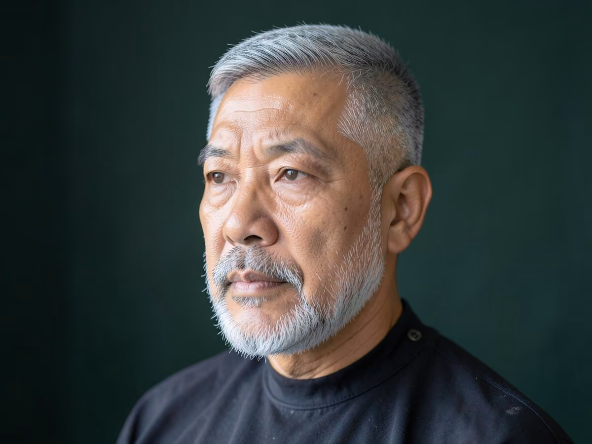 Man with a gray beard fade