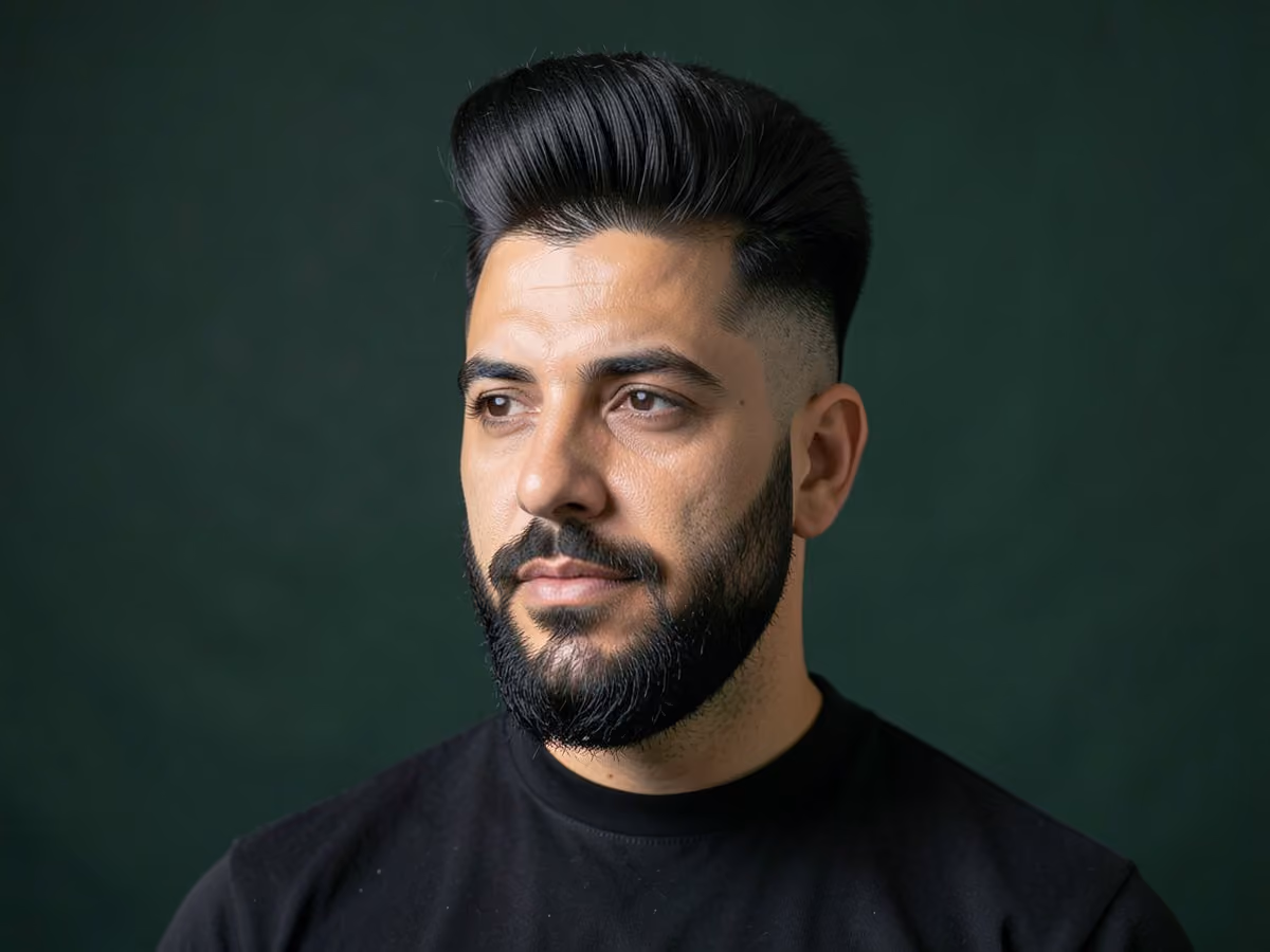 Man with a pompadour with beard fade