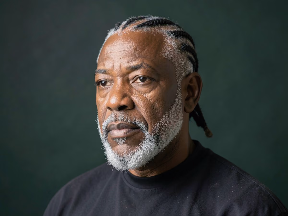 Man with a cornrows with van dyke haircut