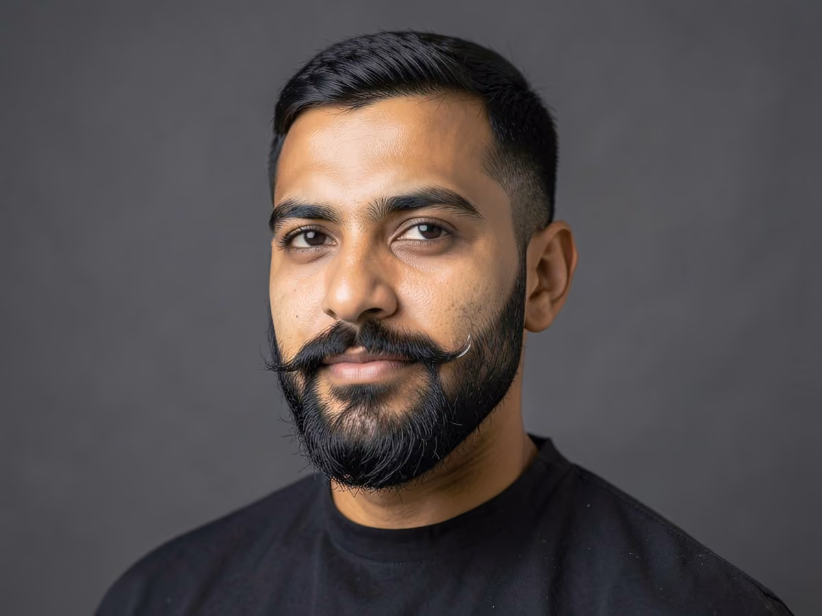 Man with a beard with waxed mustache haircut