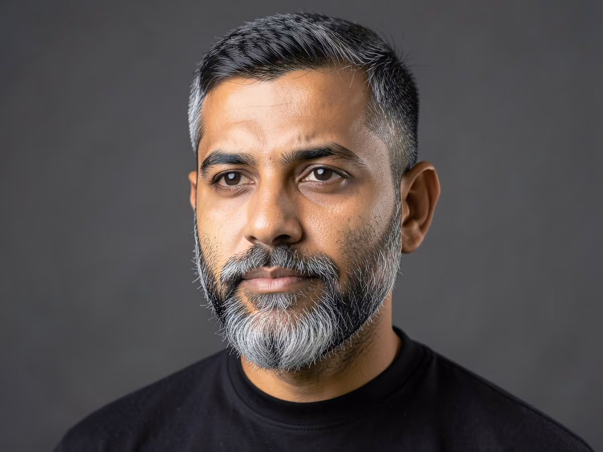 Man with a salt and pepper beard haircut