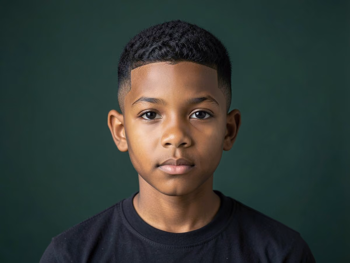 Boy with a black boys brush cut