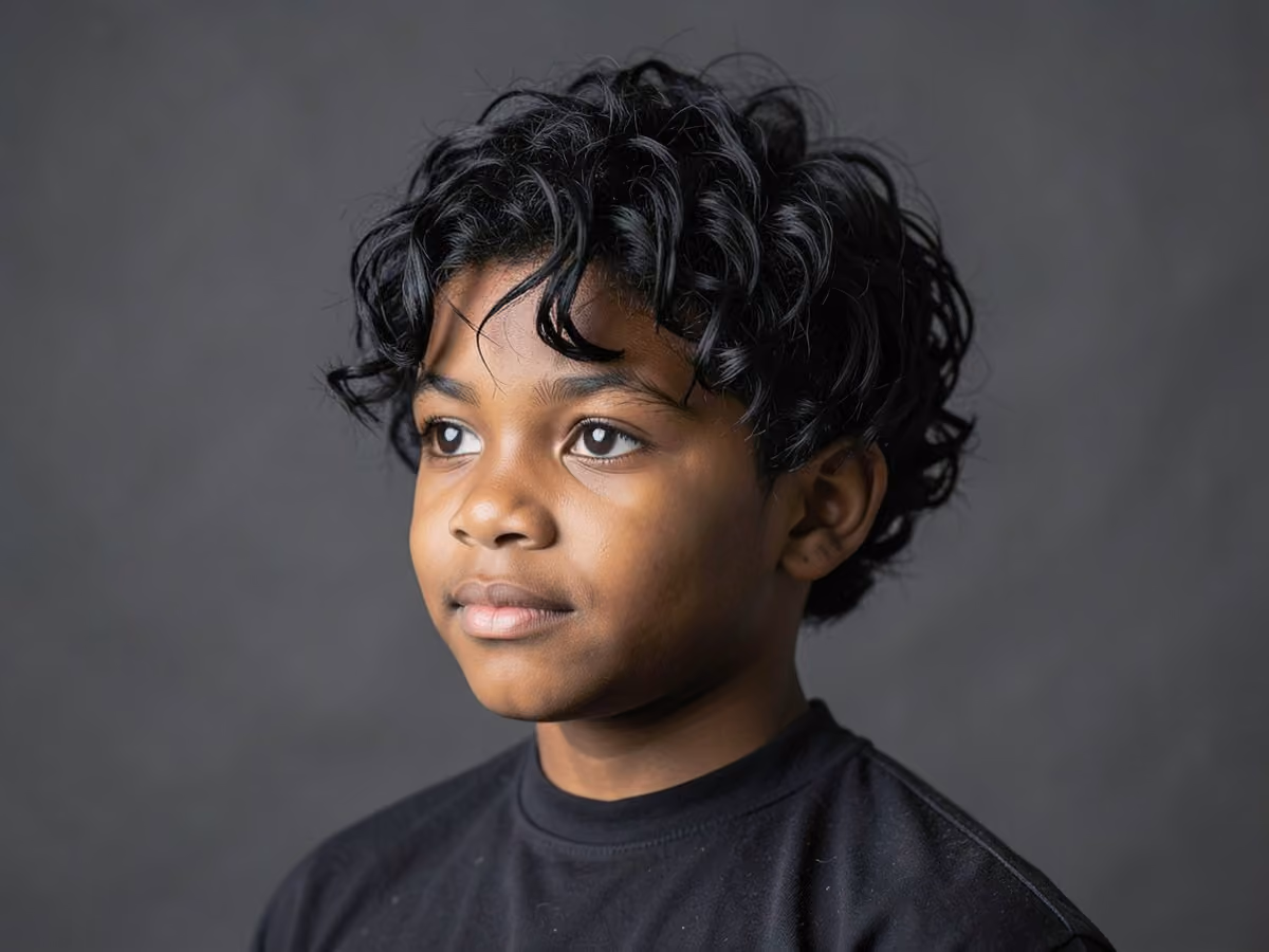 Boy with a black boys wolfed waves haircut