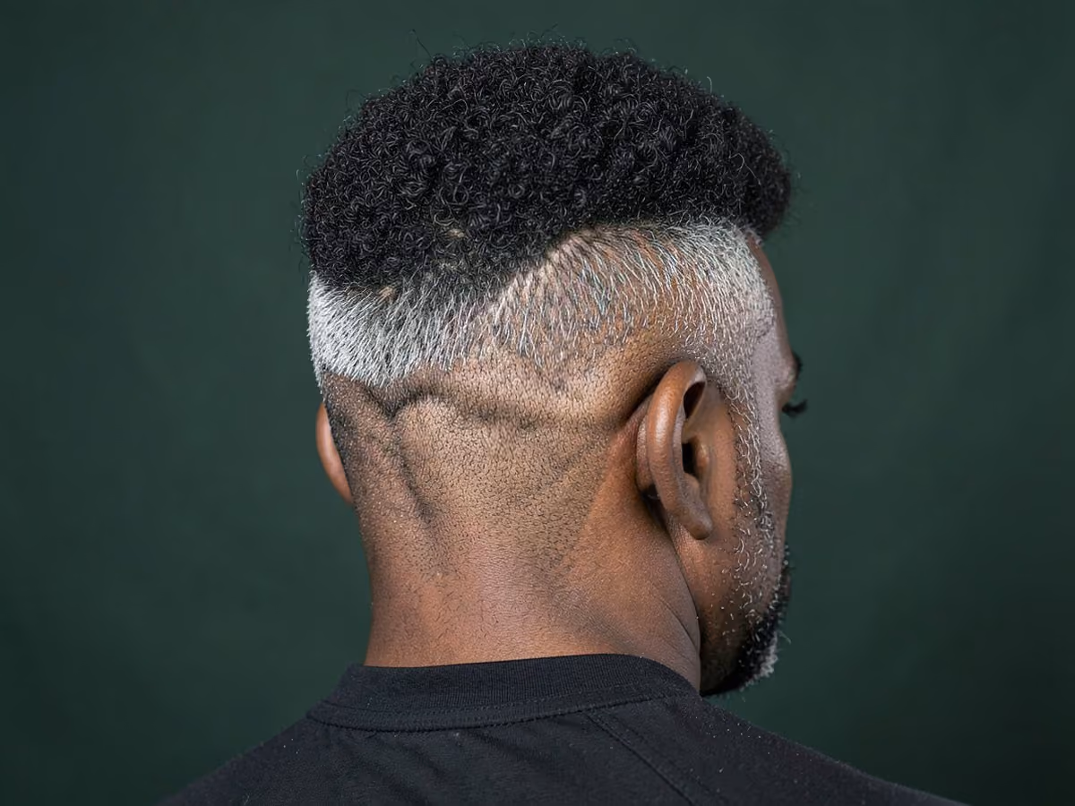 Man with an afro blowout taper haircut