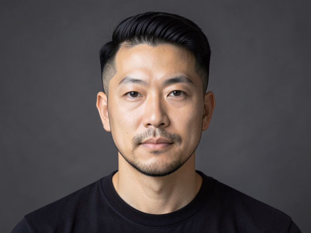 Man with a grown out blowout taper haircut