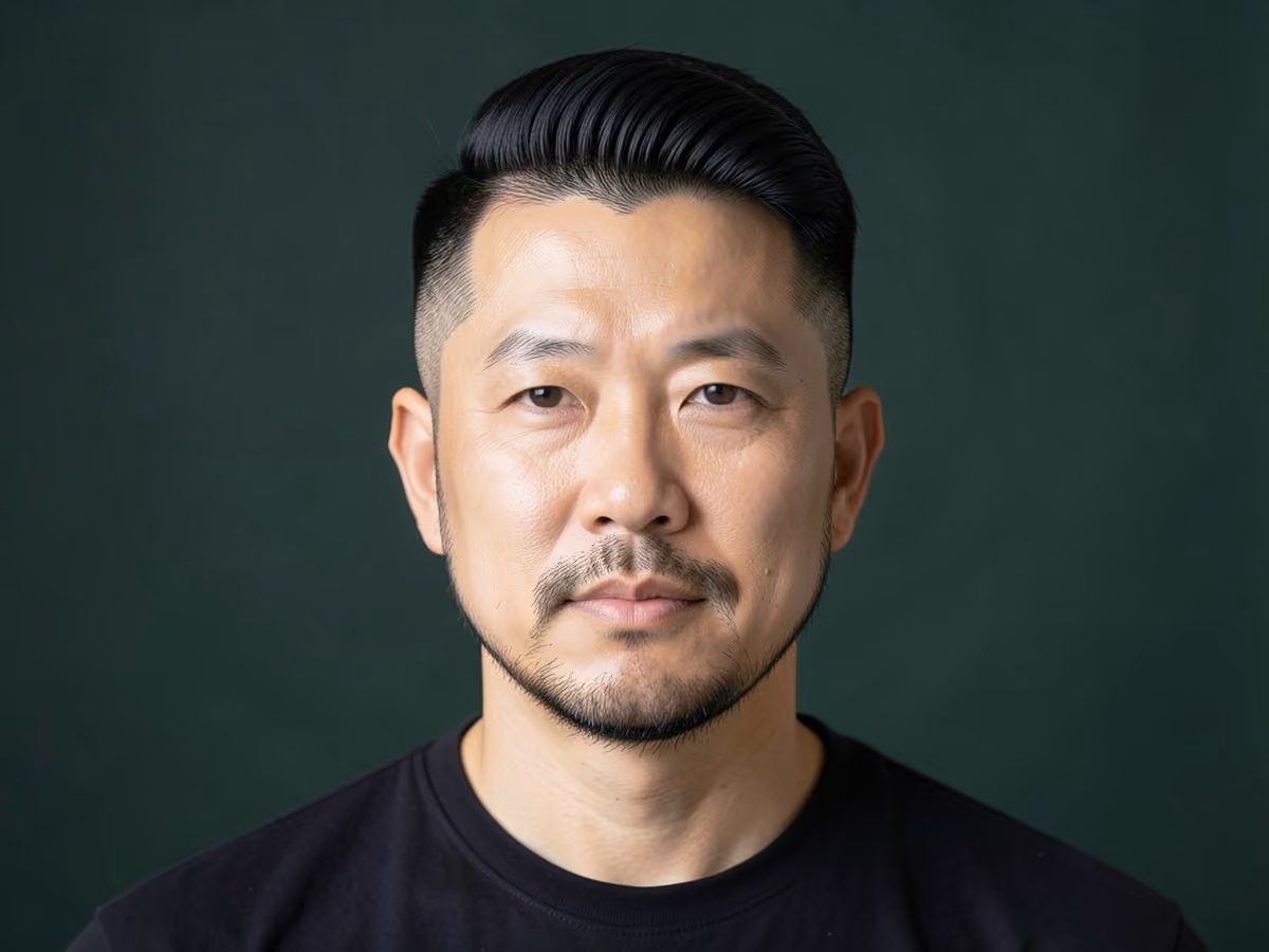 Man with a permed blowout taper haircut