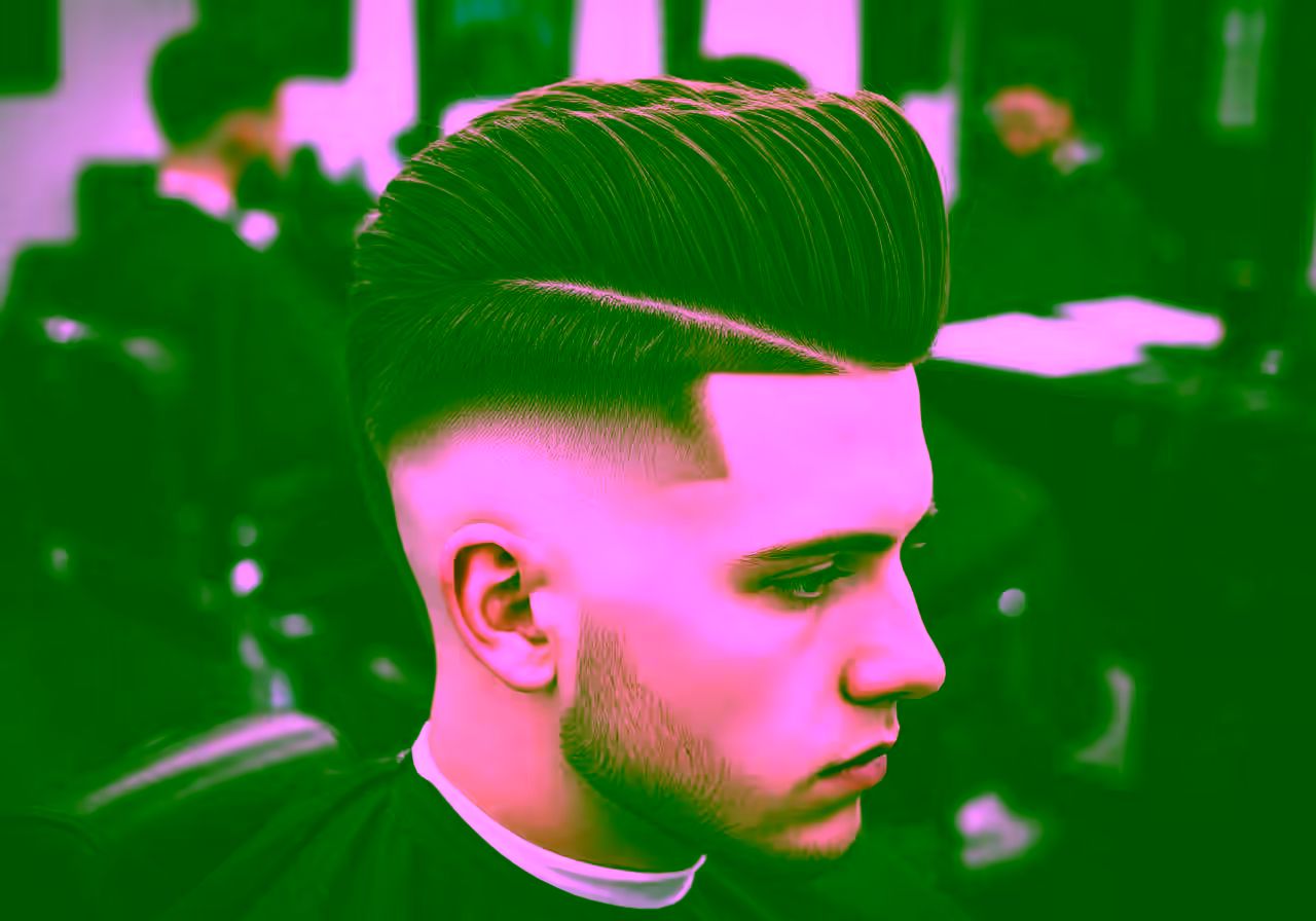 Burst Fade Faux Hawk hairstyle for men 2026 — burst fade variation, best for oval, round faces + thick hair, modern barbering by Master Stylist Jessica Hamilton