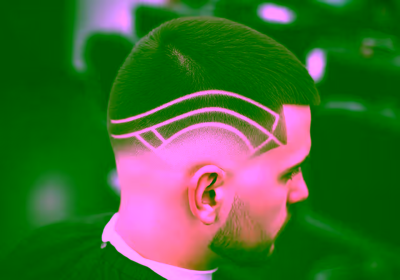 Burst Fade with Line Design hairstyle for men 2026 — burst fade variation, best for creative men + all faces, modern barbering by Master Stylist Jessica Hamilton