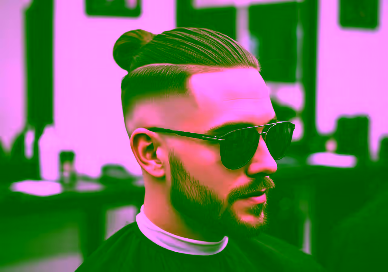 Burst Fade Man Bun hairstyle for men 2026 — burst fade variation, best for all faces + straight/wavy/curly hair, modern barbering by Master Stylist Jessica Hamilton