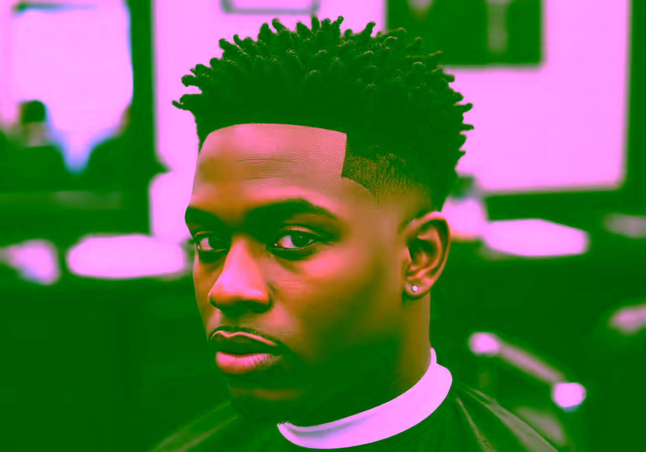 Burst Fade Sponge Twists hairstyle for men 2026 — burst fade variation, best for all faces + coily/curly hair, modern barbering by Master Stylist Jessica Hamilton