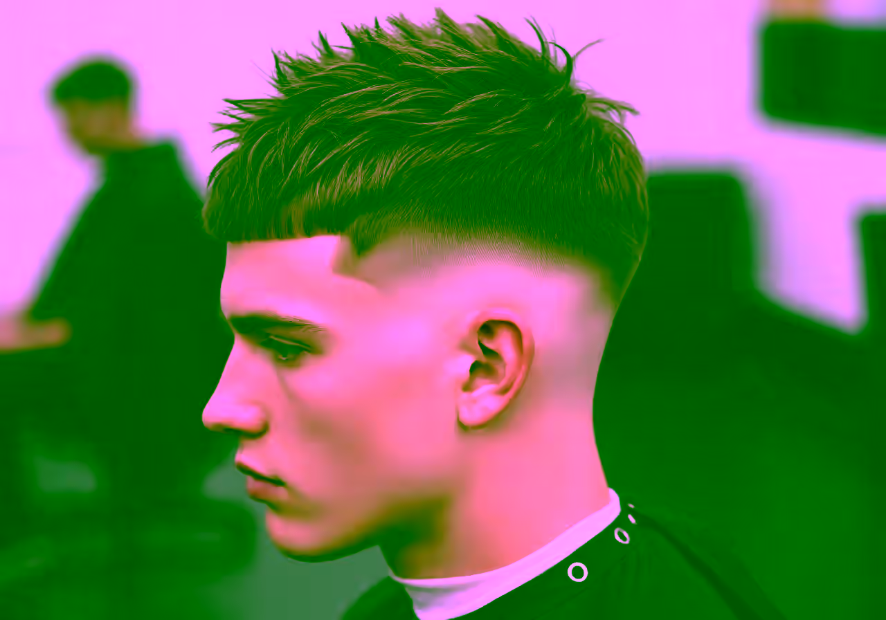Burst Fade Textured Crop hairstyle for men 2026 — burst fade variation, best for square, diamond faces + wavy hair, modern barbering by Master Stylist Jessica Hamilton