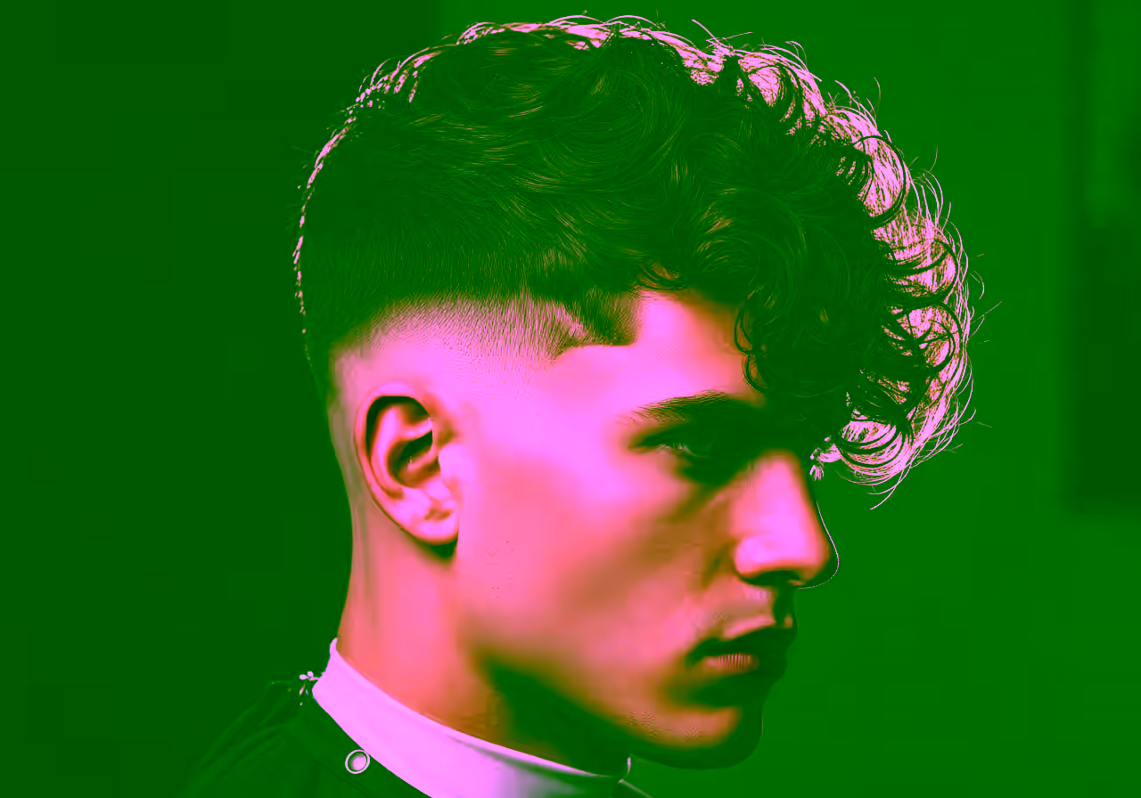 Burst Fade with Thick Curls hairstyle for men 2026 — burst fade variation, best for diamond, heart faces + thick curly hair, modern barbering by Master Stylist Jessica Hamilton