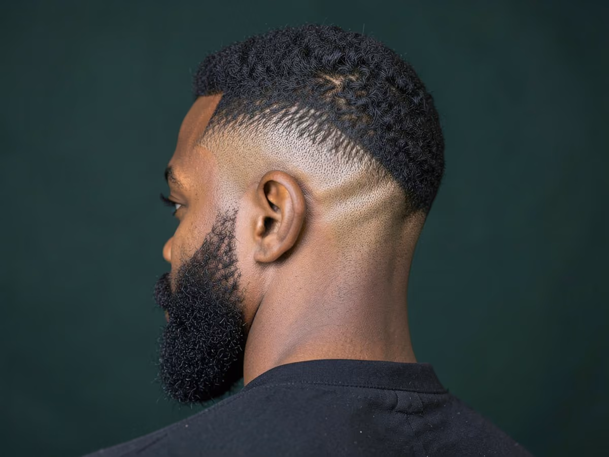 Man with a butch cut with burst fade