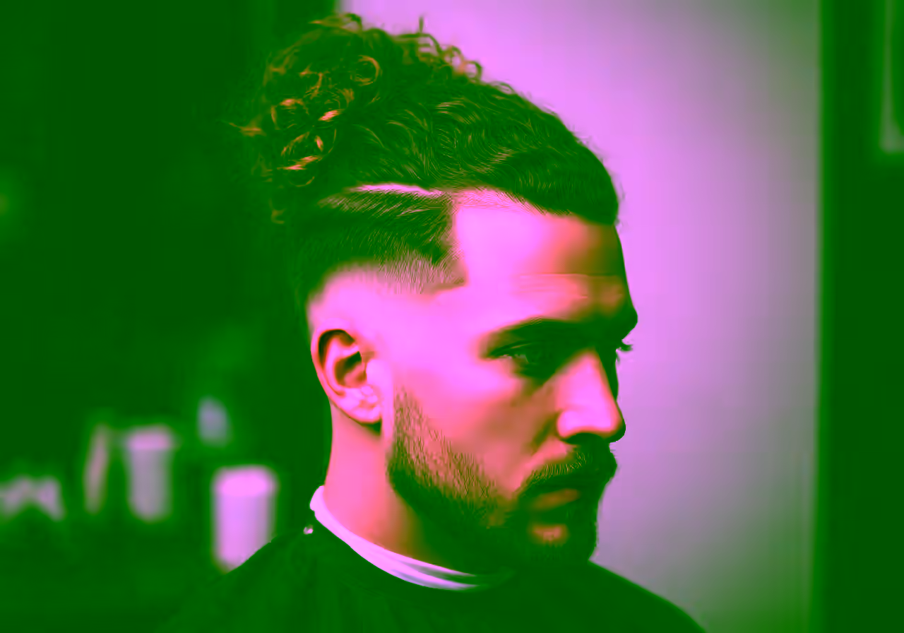 Curly Man Bun hairstyle for men 2026 — curly hairstyles variation, best for relaxed cool style + all faces + 3b–4a curls, modern barbering by Master Stylist Jessica Hamilton