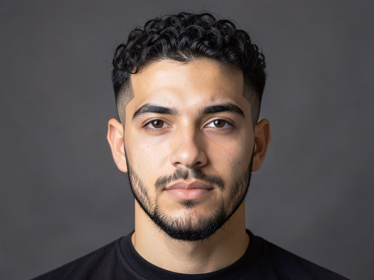 Man with a fine curly undercut