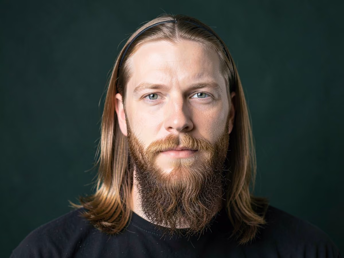 Man with a david beckham alice band haircut
