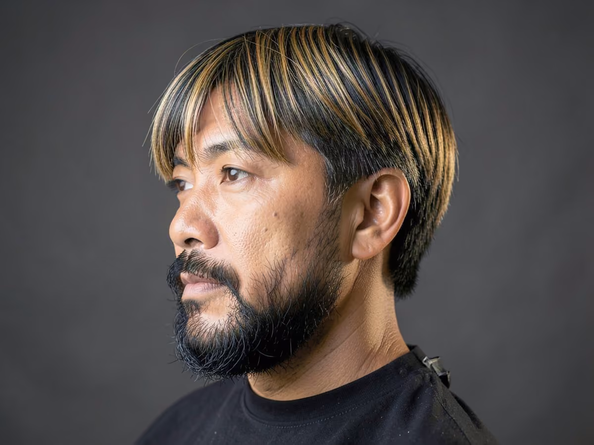 Man with a david beckham curtains haircut