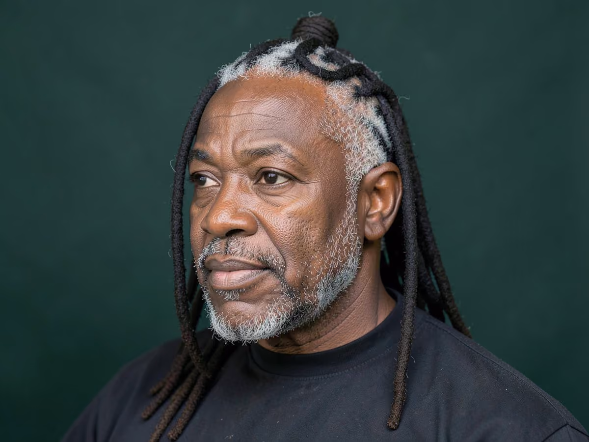 Man with a half up locs haircut