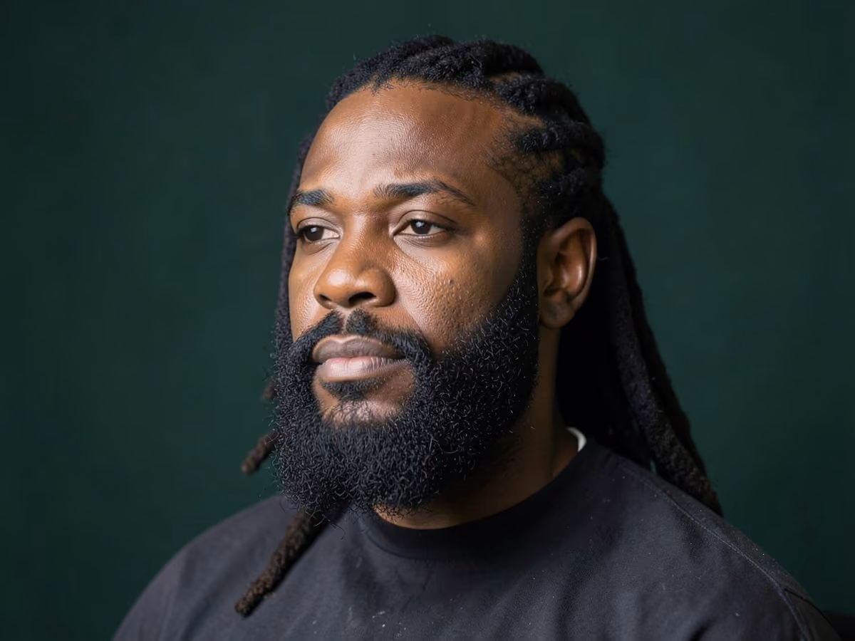 Man with a locs with full beard haircut