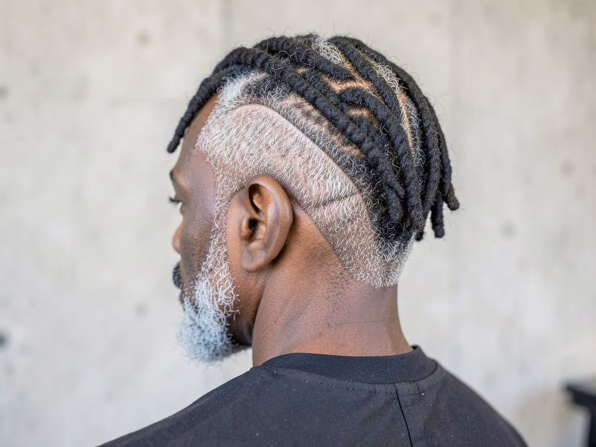 Man with a short dreads with burst fade