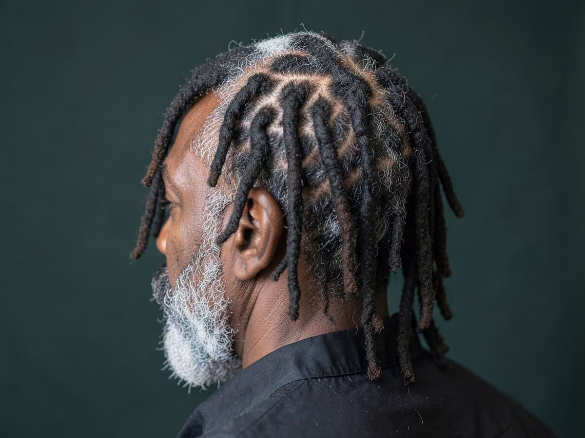 Man with a triangle part locs
