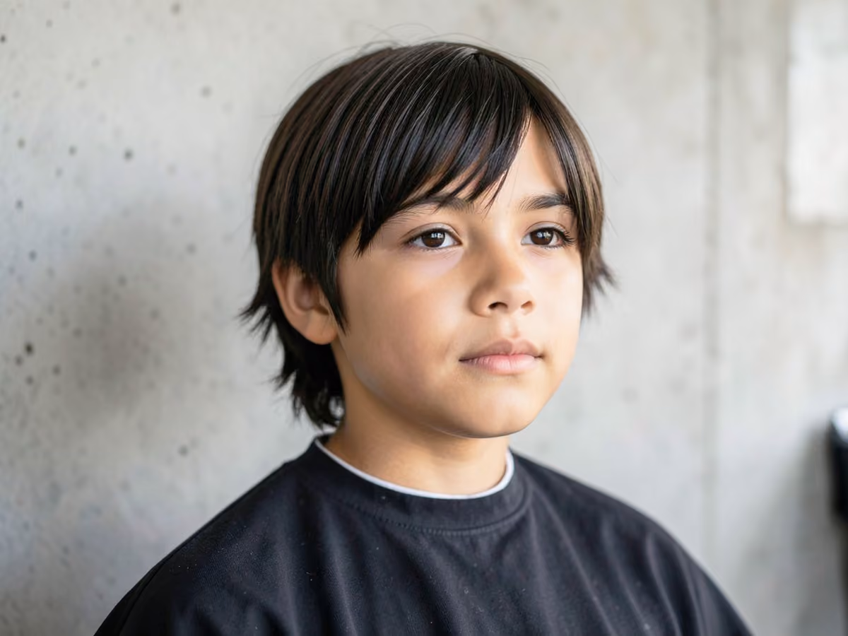 Boy with a long e-boy haircut