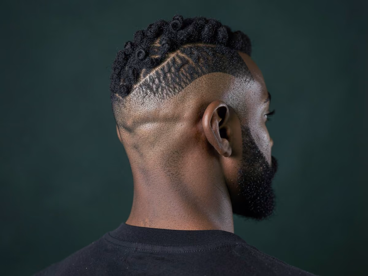 Man with a burst fade with coils