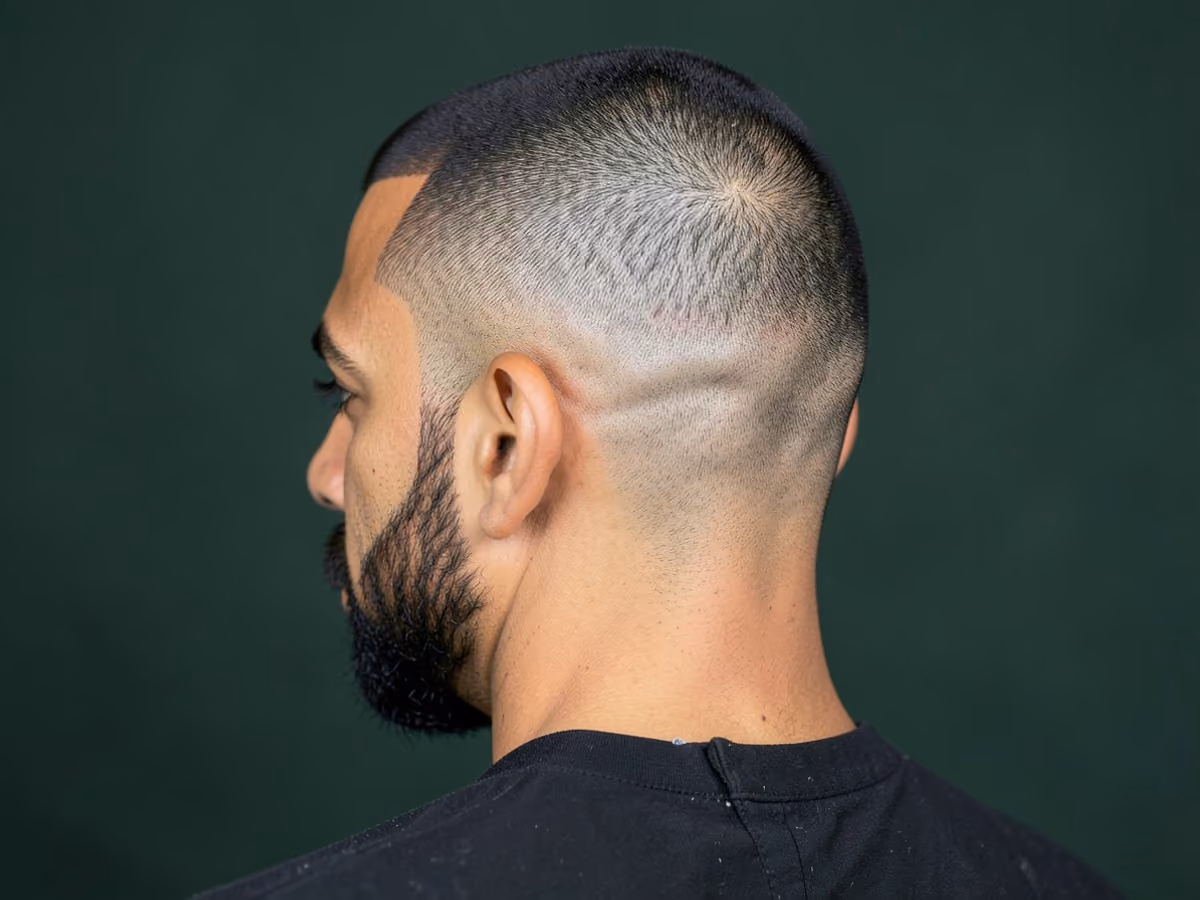 Man with a mid fade flat top