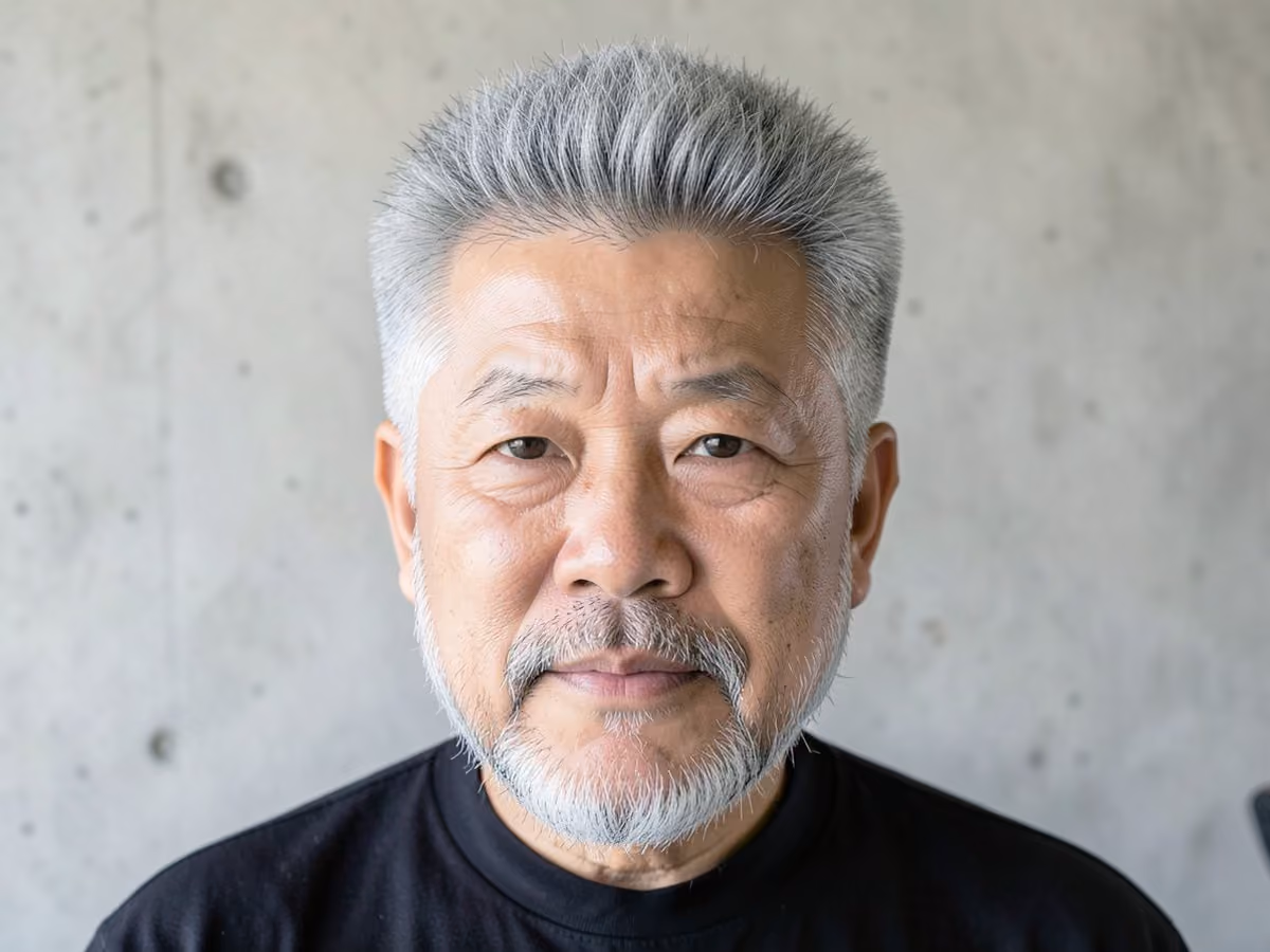 Man with a fluffy hair with mid fade