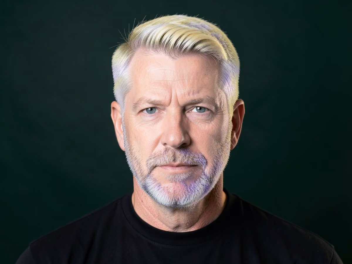 Man with an ash blonde frosted tips haircut