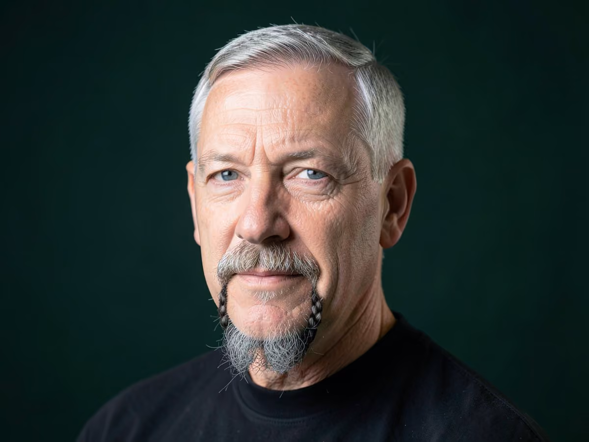 Man with a braided goatee haircut