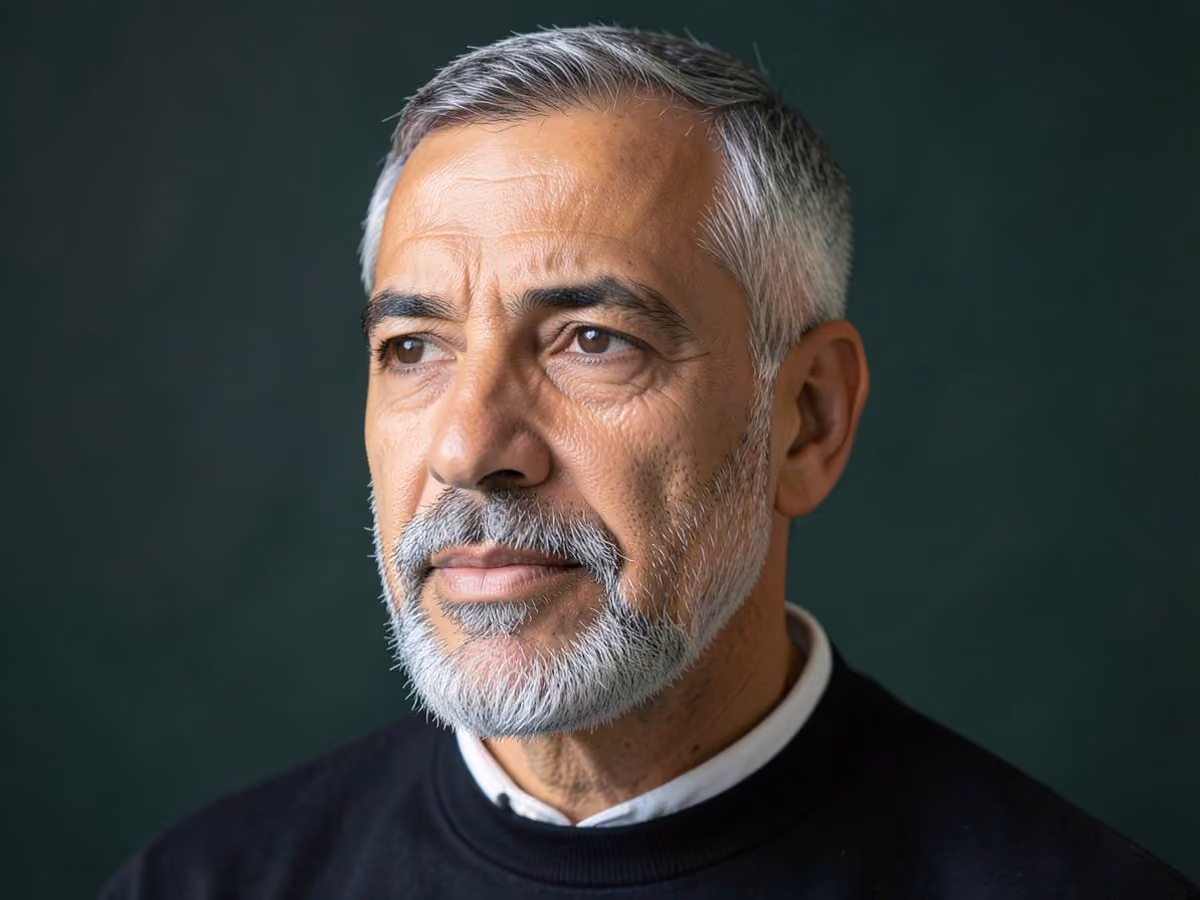Man with a gray goatee haircut