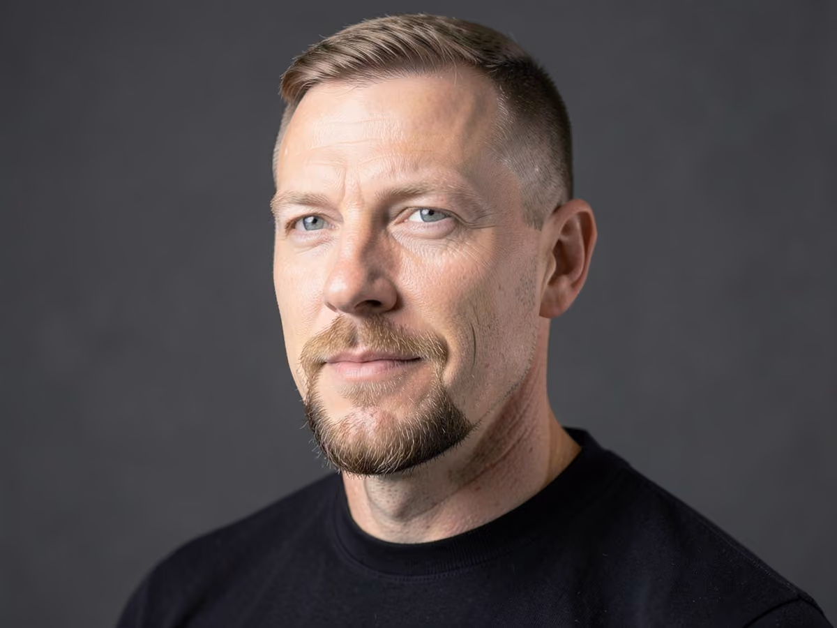 Man with a short goatee haircut