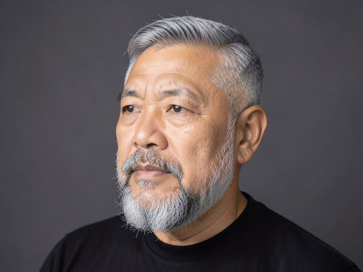Man with a silver taper with gray beard haircut