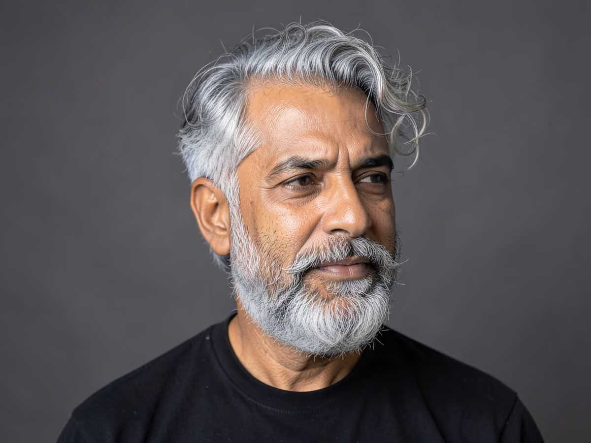 Man with a messy grow-in crop haircut