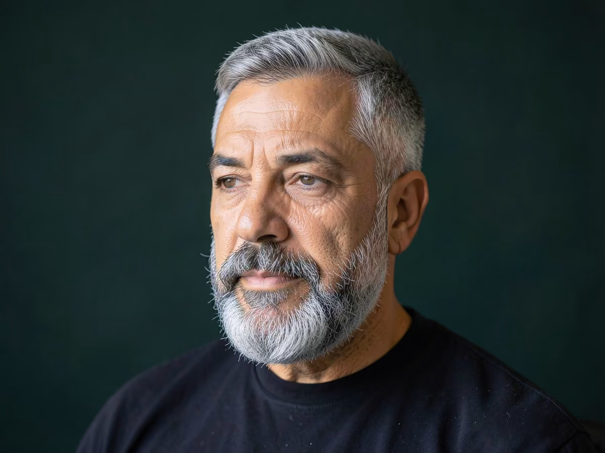 Man with a mature crop with full beard haircut
