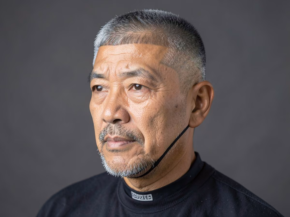 Man with an edgar cut with chin strap