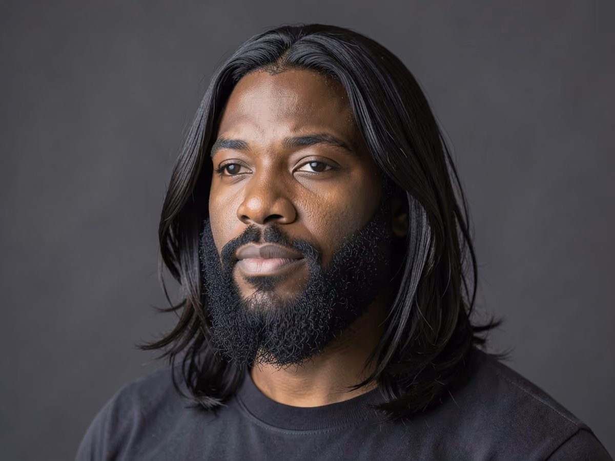 Man with a shoulder length hair with full beard