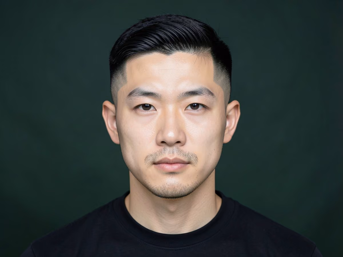 Man with a hard part temple fade
