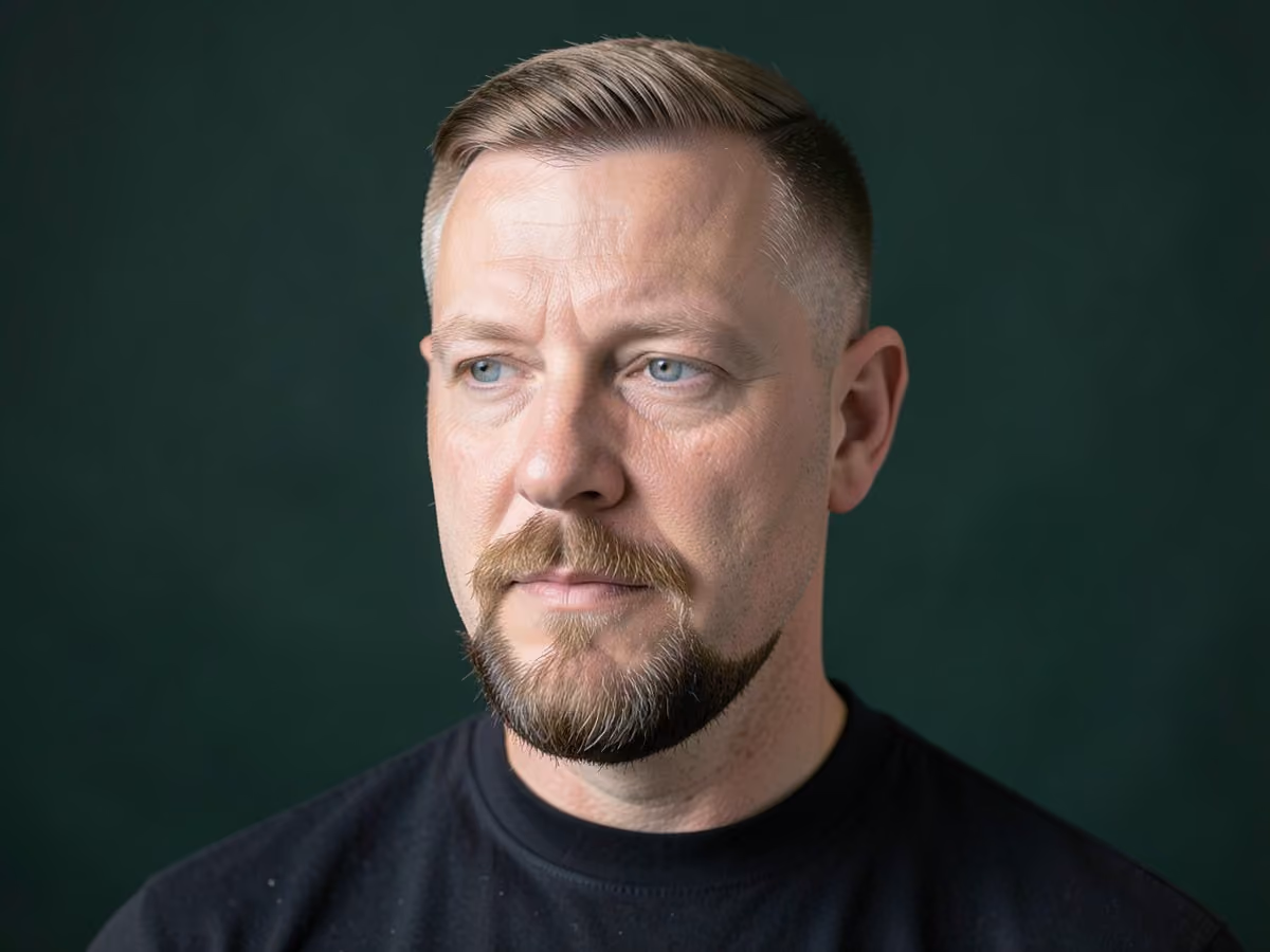 Man with a hard part with goatee