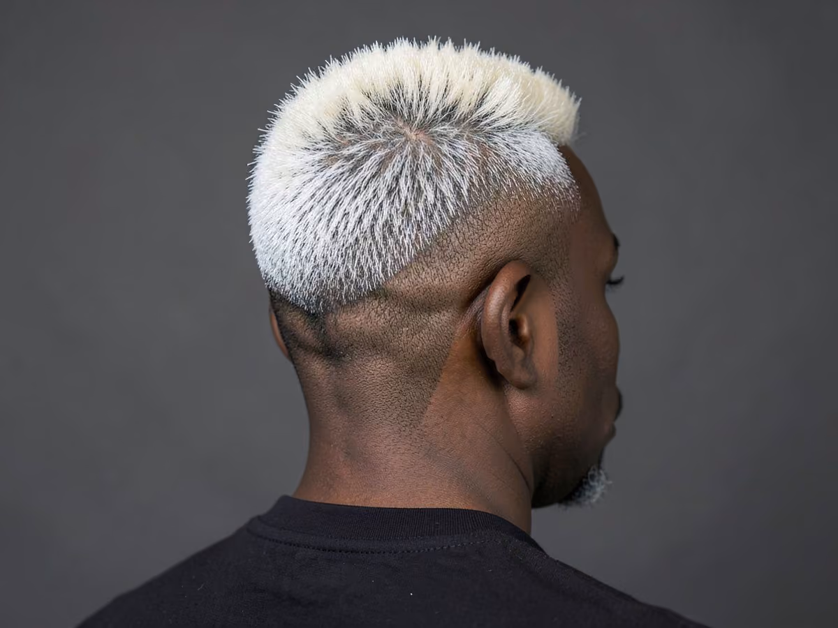 Man with a high fade with frosted tips